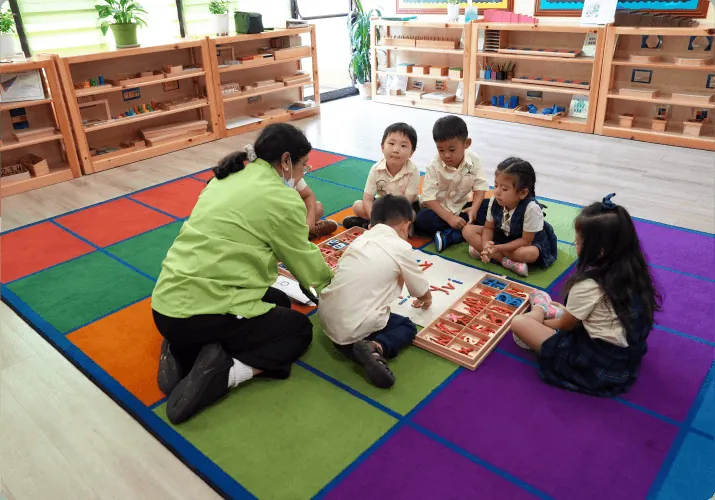 Teacher guiding a child at Diamond Bar Montessori Academy